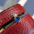 sapphire blue CZ helix stud earring in gold
