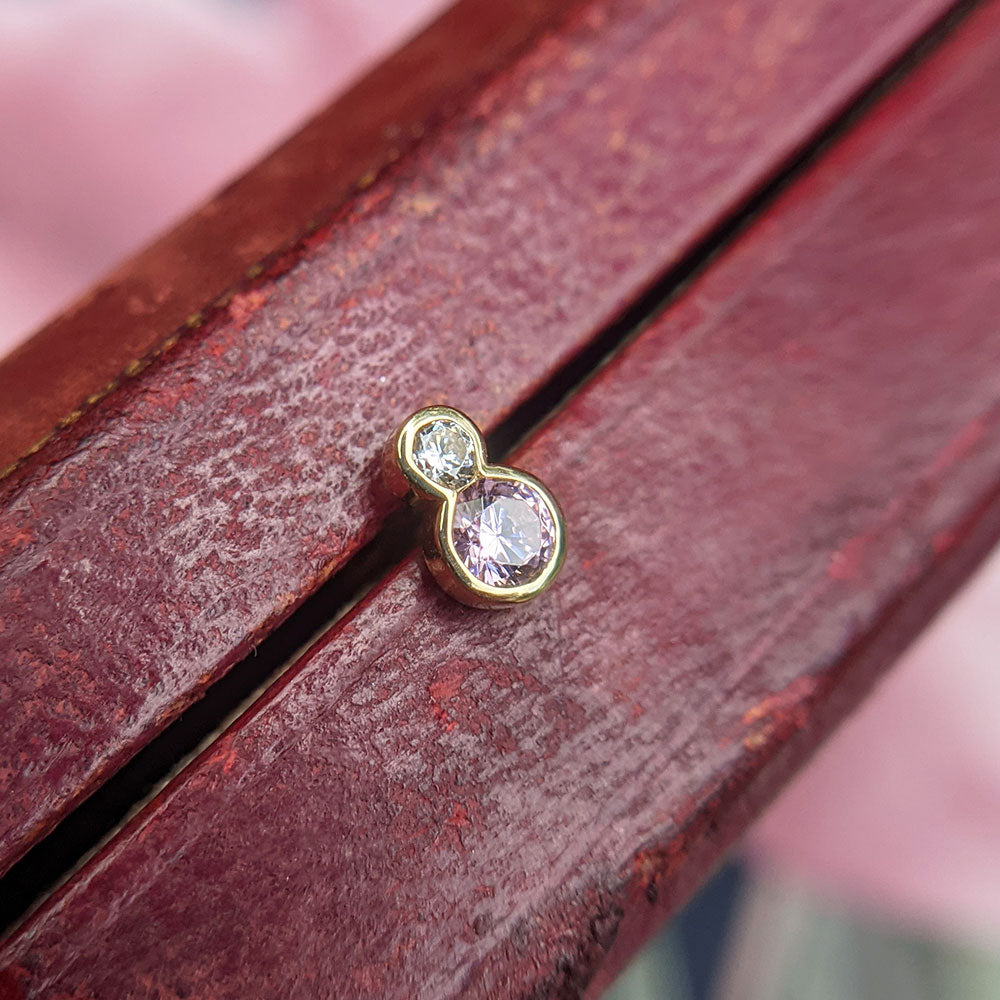 pink and colourless CZ helix earring in 9K gold