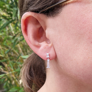 dainty baguette cz earrings in ear