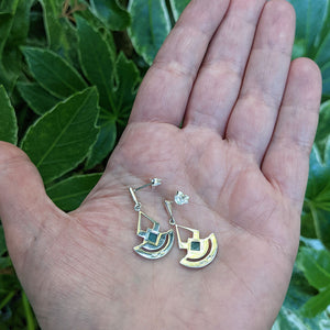 our drop earrings in hand