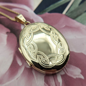 solid 9ct yellow gold oval locket with Celtic deisgn