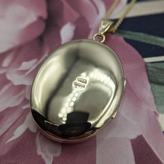 reverse of locket with full UK hallmarks