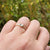 close up of aquamarine ring on hand