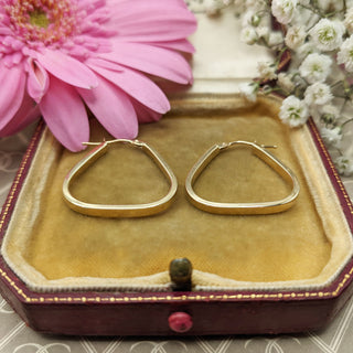 gold triangular hoop earrings in 9ct