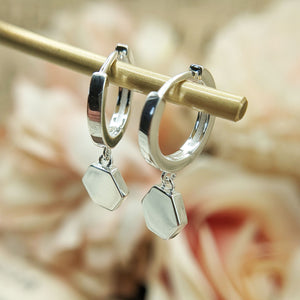 side view of huggie earrings