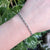 close up of prince of wales bracelet on wrist