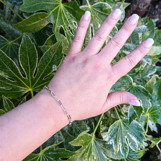 another view of silver paperclip bracelet being worn