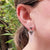 vintage style triangle earrings in ear