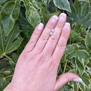 topaz earrings hand for scale