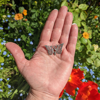 marcasite butterfly brooch in hand for scale