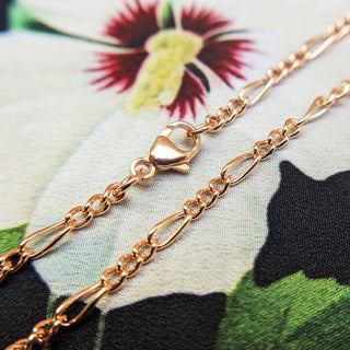 close up of 9ct rose gold figaro links